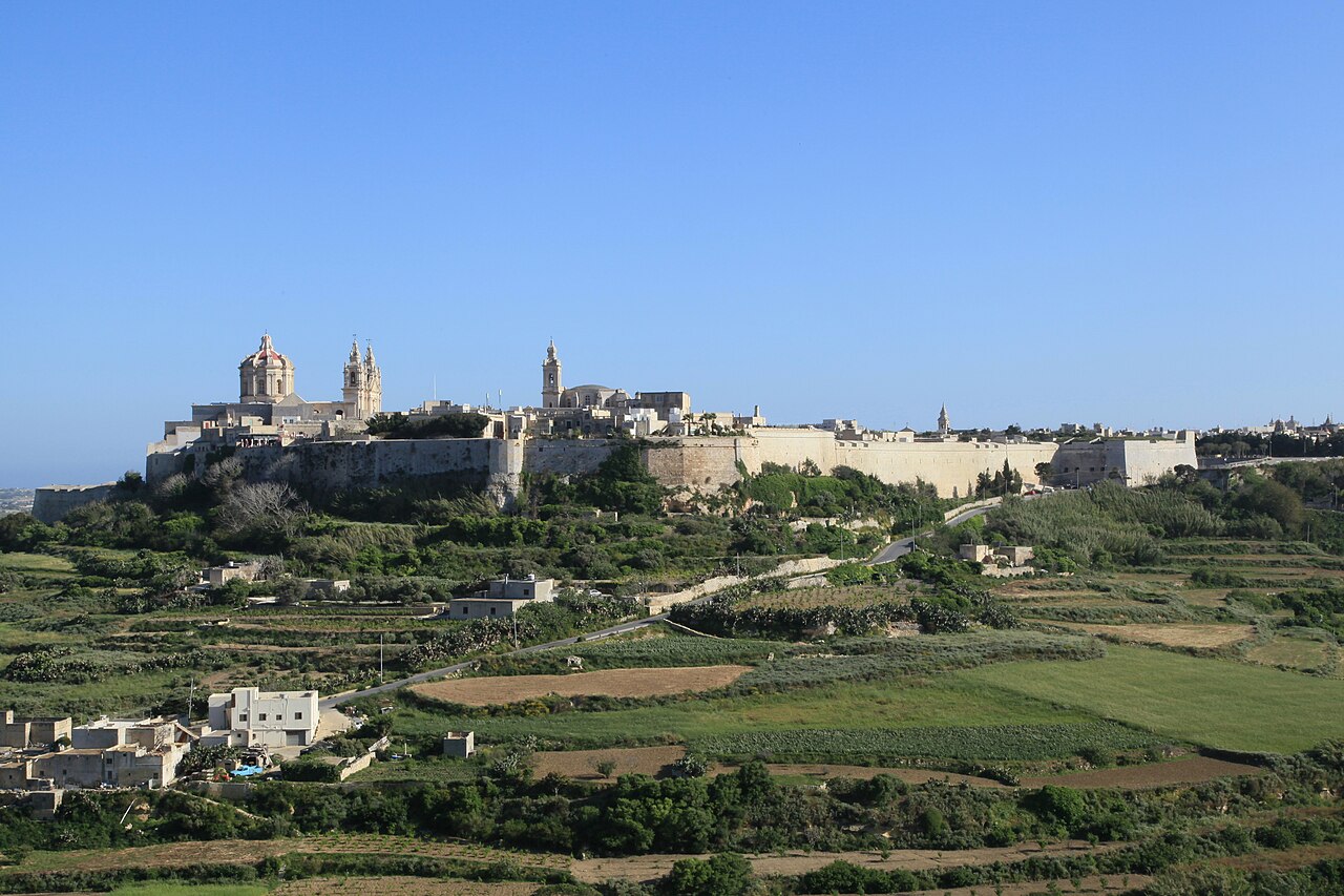 The fortified city of Mdina seen across the Maltese countryside